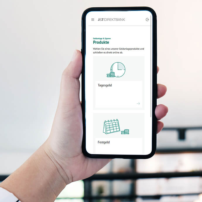 J&T Direktbank App auf dem Smartphone in der Hand